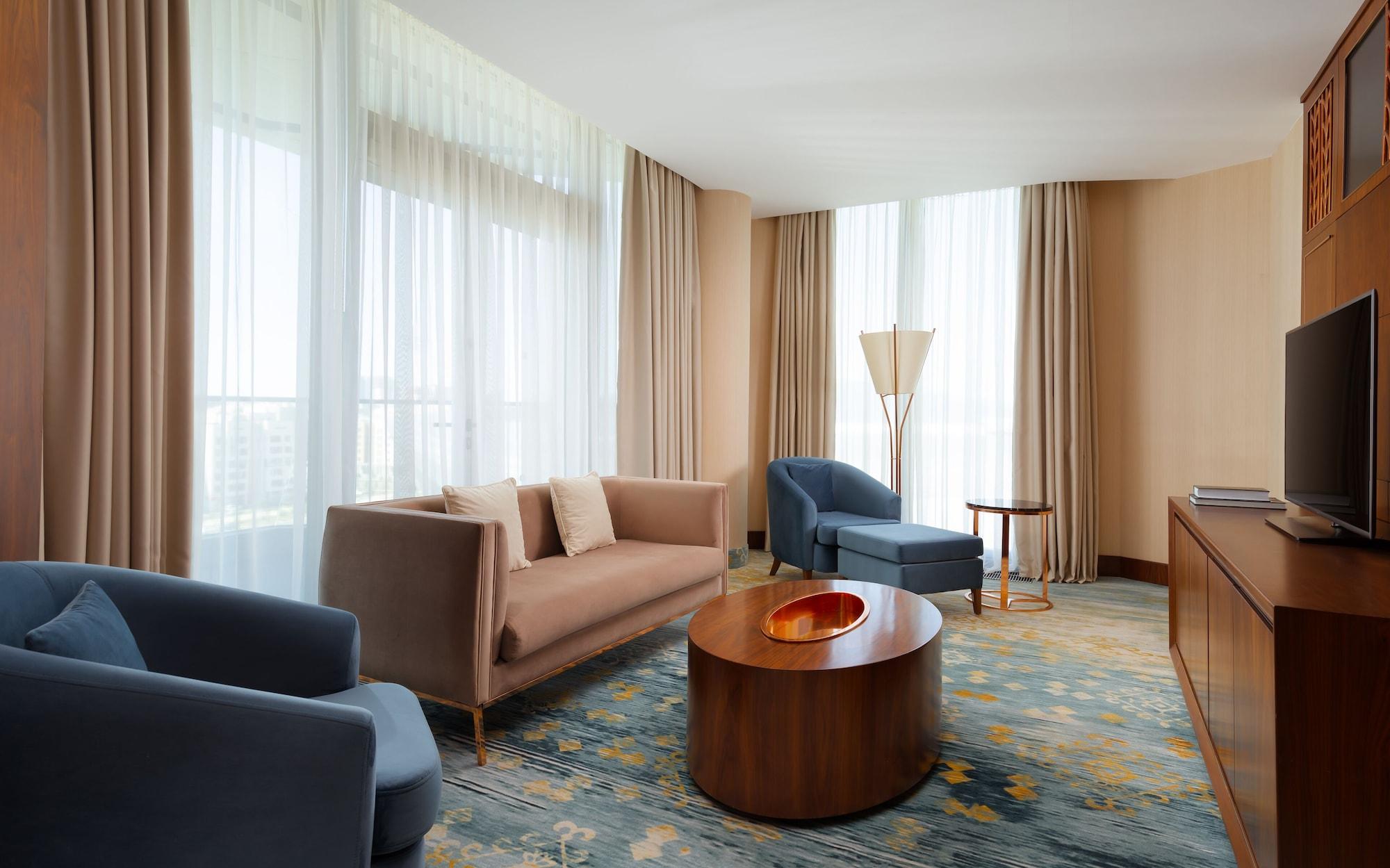 Hilton Astana Hotel Exterior photo A living room at the hotel