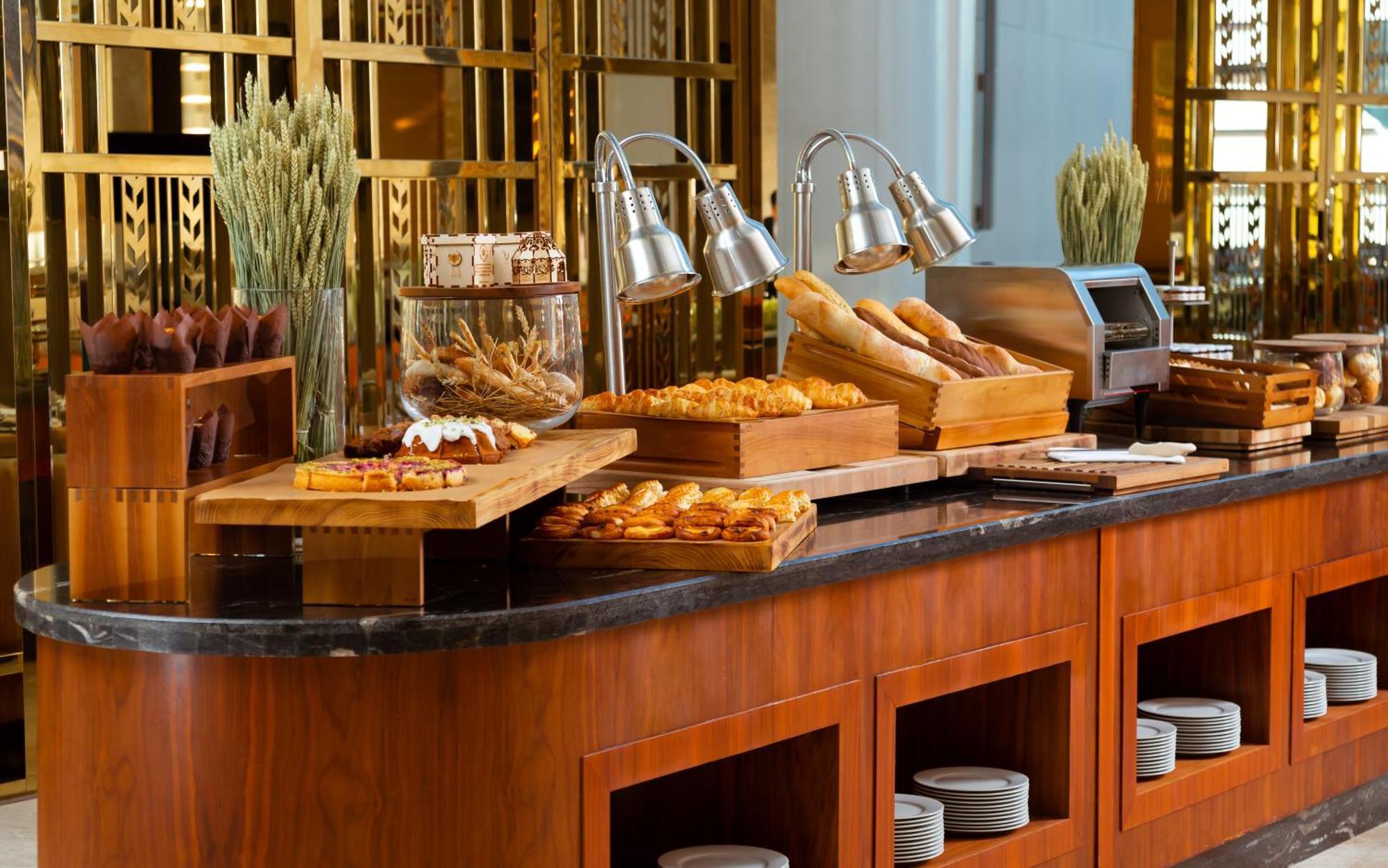 Hilton Astana Hotel Exterior photo A buffet at a hotel